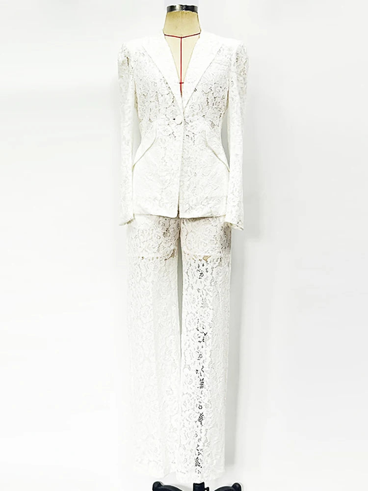 White lace suit on a mannequin against a white background