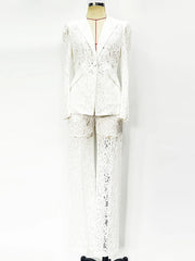 White lace suit on a mannequin against a white background