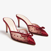 Red mesh stiletto pumps with polka dots and a bow