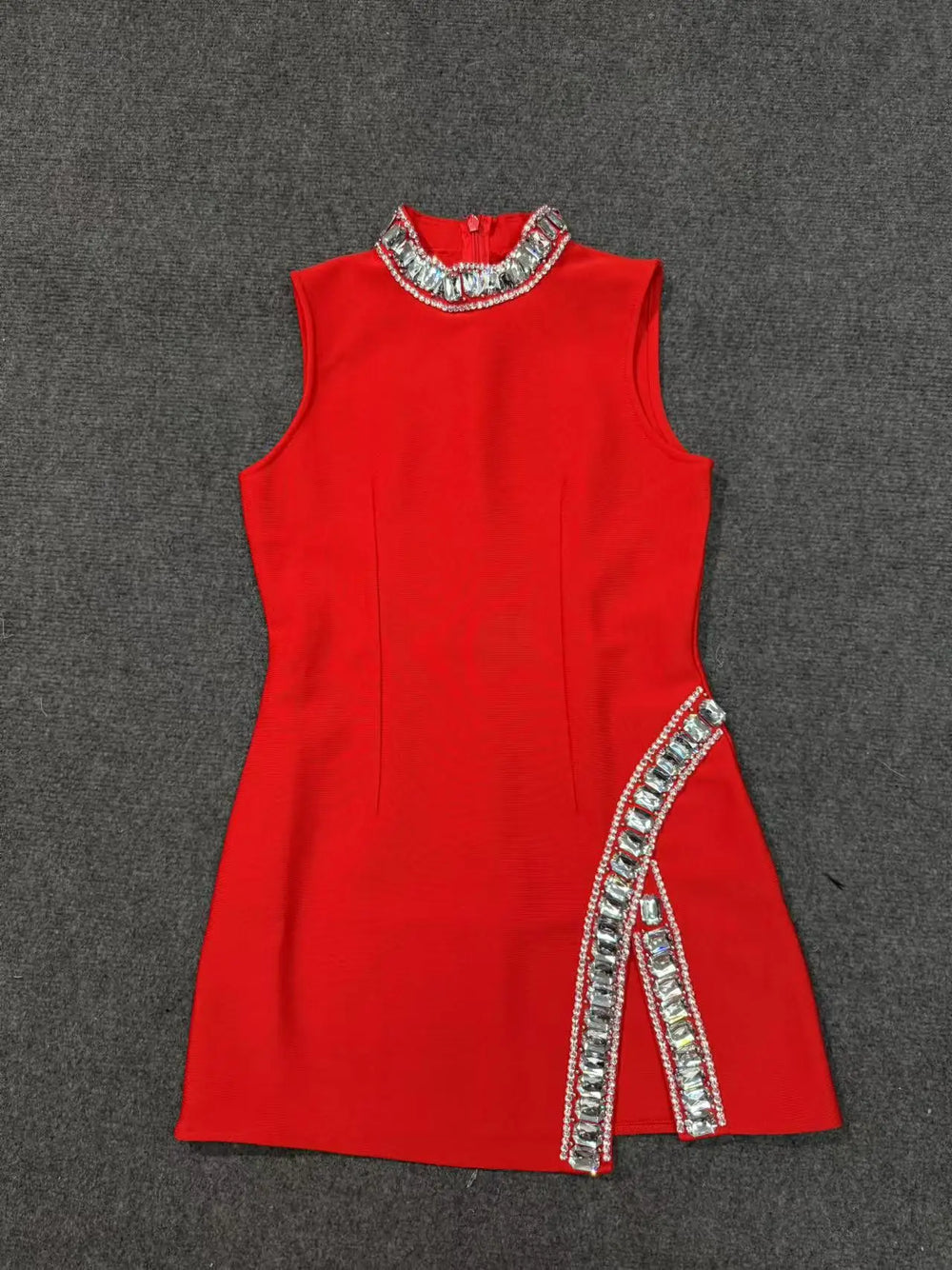 Red dress with silver embellishments on a gray background