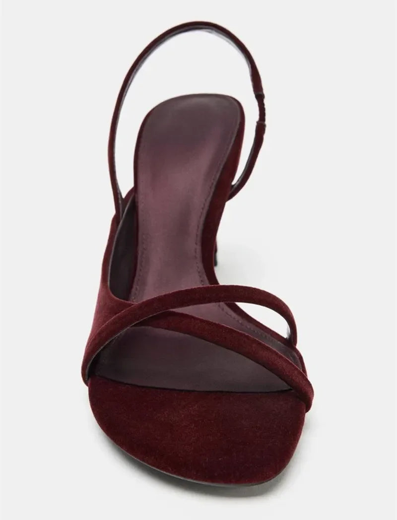 Front close-up of burgundy velvet cross strap stiletto heel