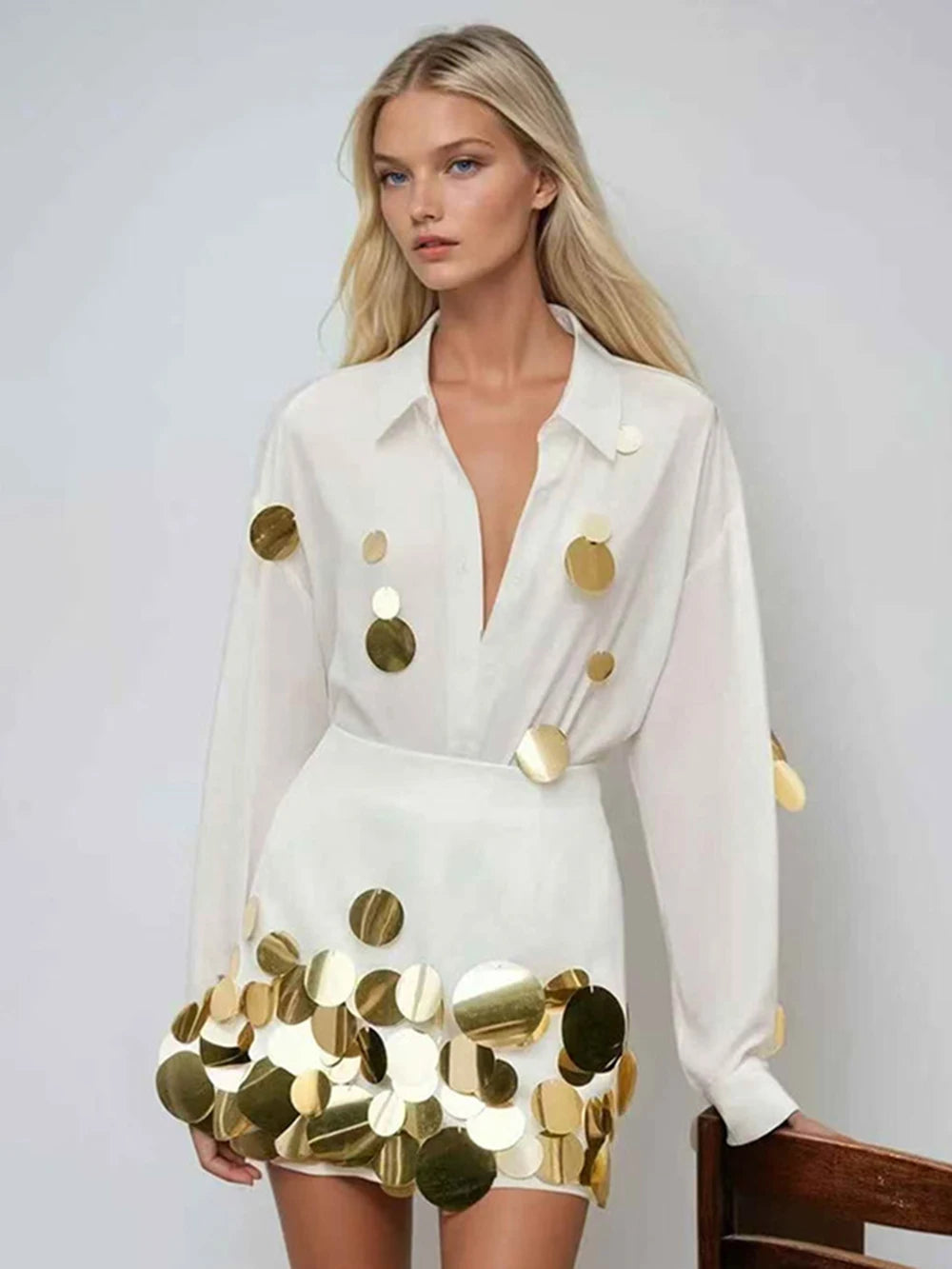 White long sleeve shirt with gold sequins and matching mini skirt