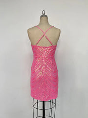 Pink sequin dress on a mannequin against a white background