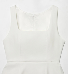 White sleeveless dress on a light gray background