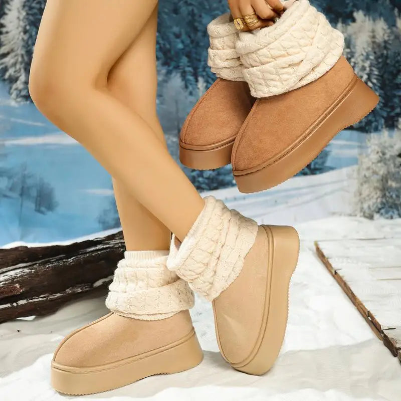 Beige winter boots with white cuffs worn by a person against a snowy background