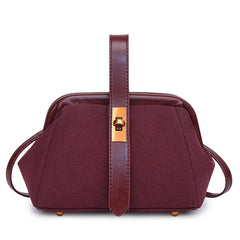Maroon handbag with a gold clasp on a white background