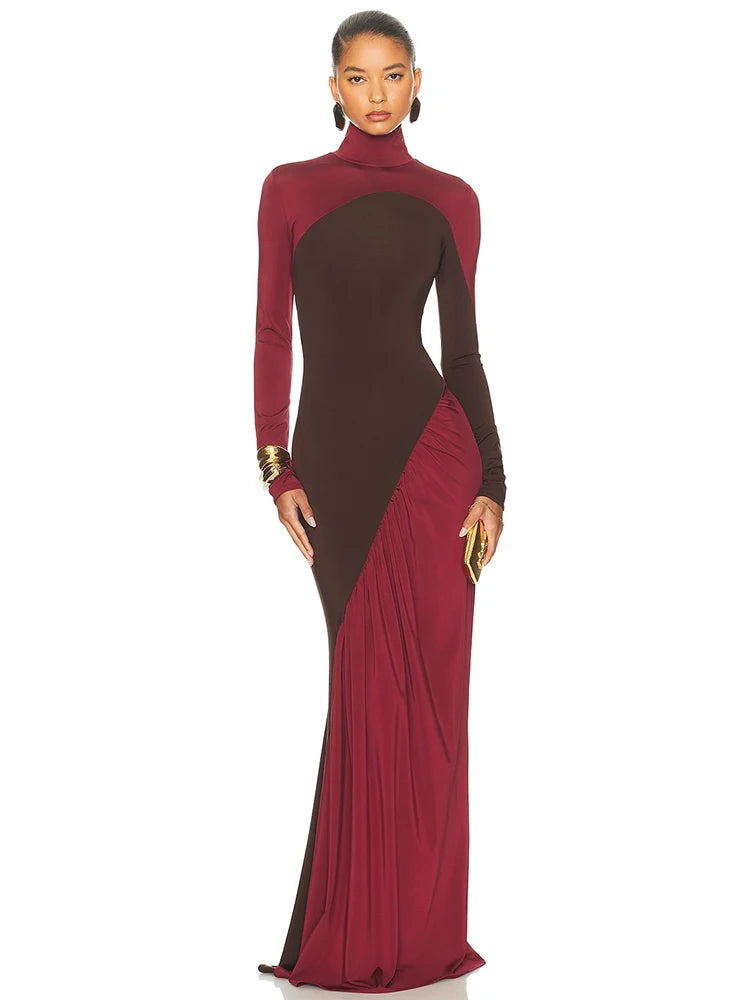 A woman wearing a two-tone dress with maroon and brown colours