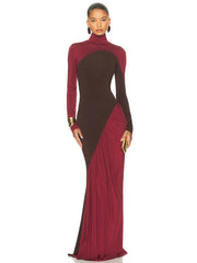 A woman wearing a two-tone dress with maroon and brown colours