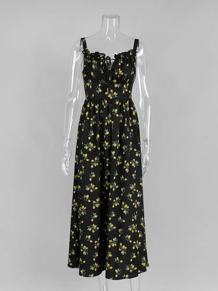 Black floral dress on a mannequin against a gray background