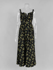 Black floral dress on a mannequin against a gray background