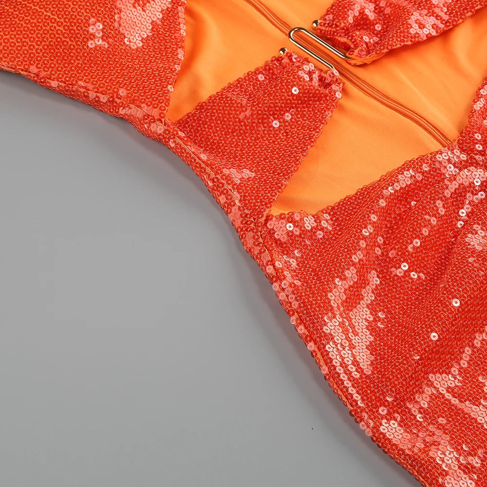 Close-up detail of sequin strapless cutout midi dress.