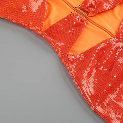 Close-up detail of sequin strapless cutout midi dress.