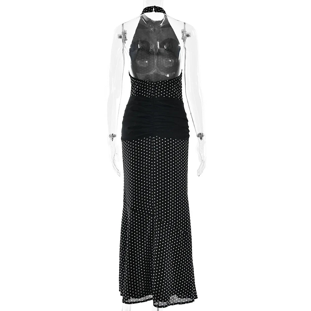 Black polka dot dress on a mannequin with a clear background
