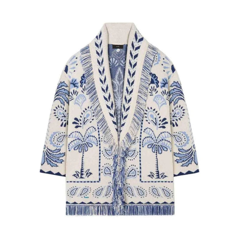 White cardigan with blue paisley pattern on a white background