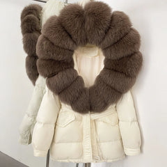 White puffer jacket with a large brown fur collar