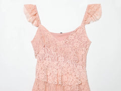 Close-up of the V-neck and lace detail on a pink mini dress