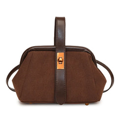 Brown handbag with a strap on a white background