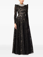 Black embroidered mesh maxi dress with beaded collar worn by model.