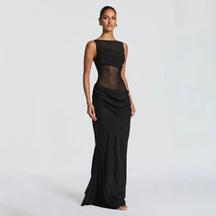 Black evening gown with sheer panels on a white background