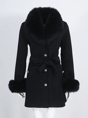 Black coat with fur trim on a white background