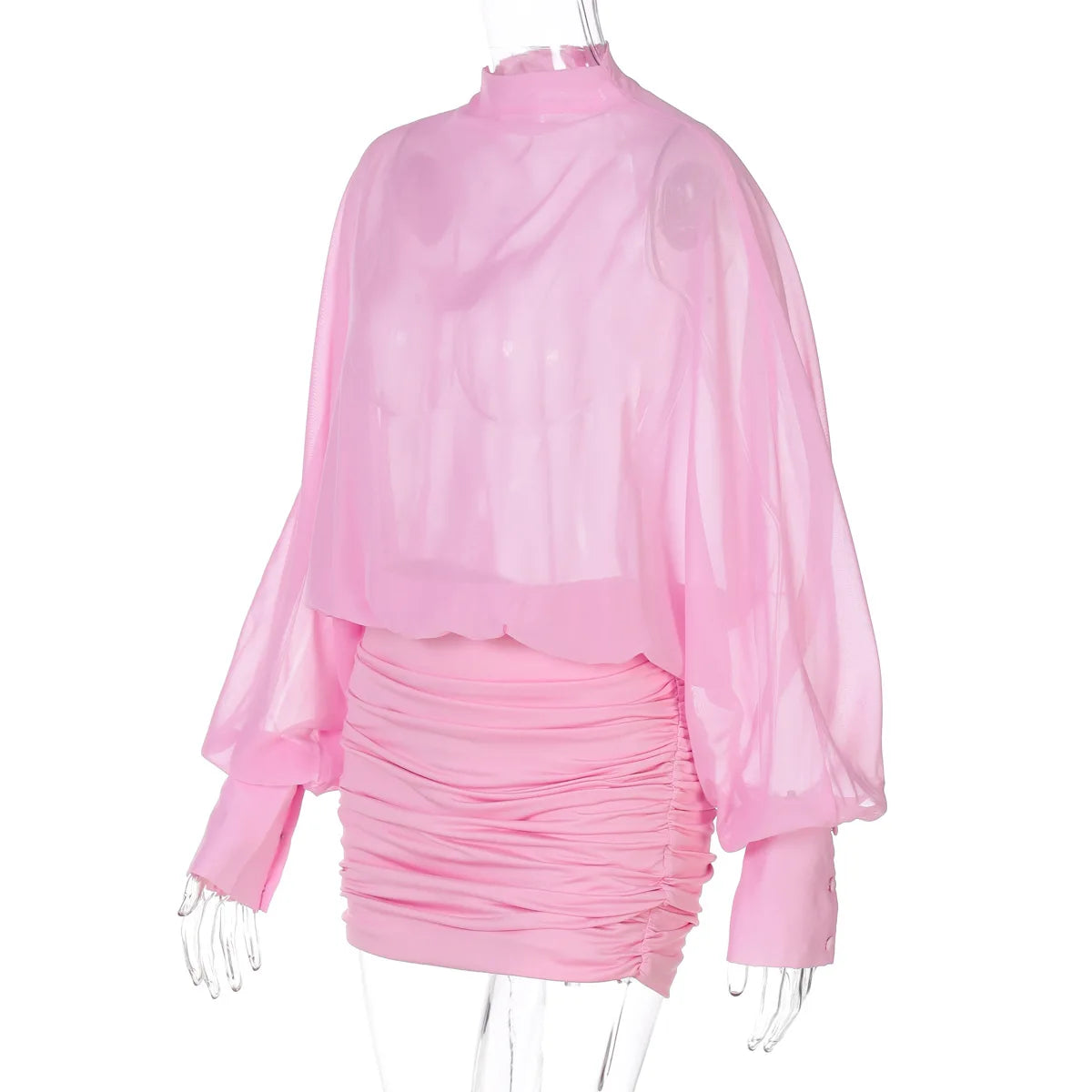 Pink ruched dress with sheer long-sleeve top on a white background