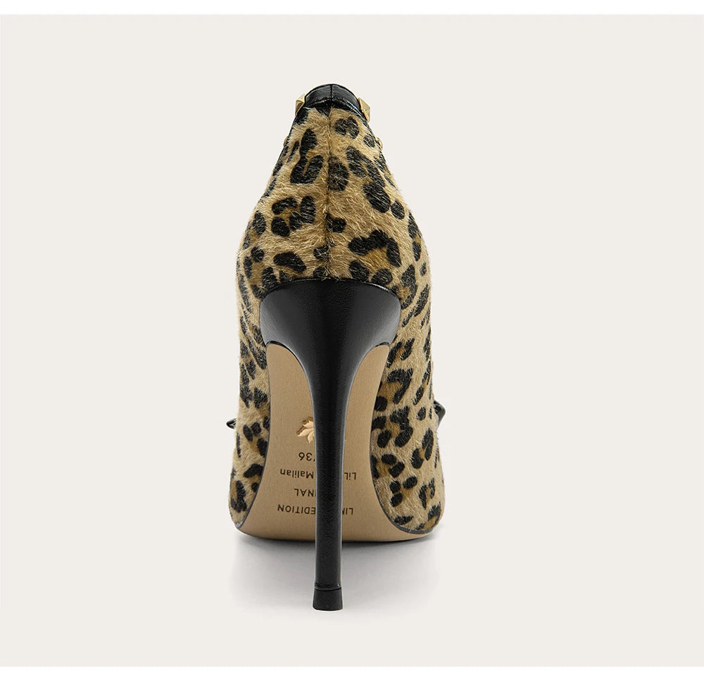 Leopard print high-heeled shoe on a white background