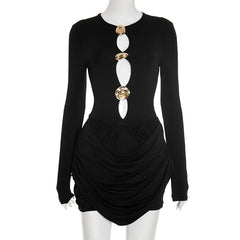 Black long-sleeve dress with a unique necklace on a mannequin against a white background