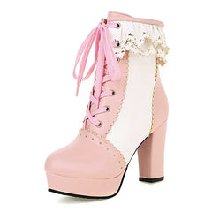Pink platform boots with lace details on a white background