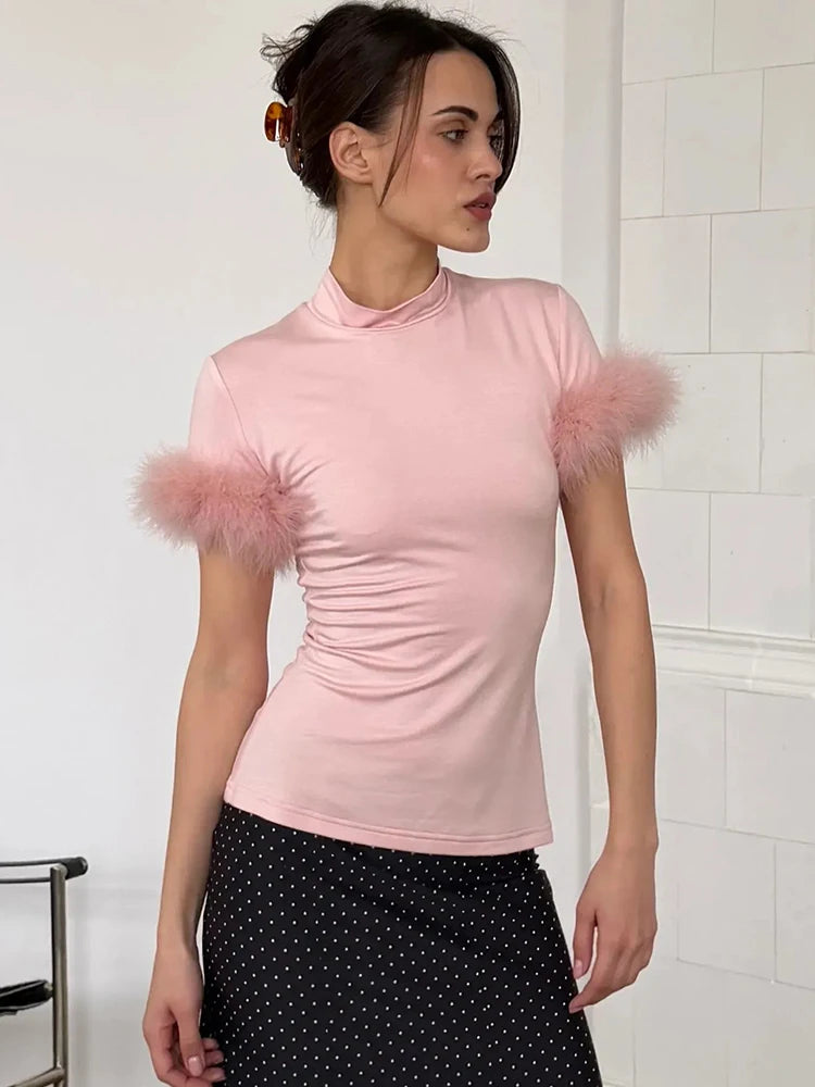 Pink mock neck feather trim top