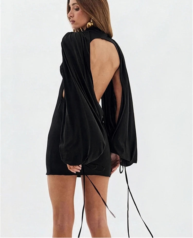 Back view of fuchsia puff sleeve turtleneck mini dress