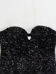 Black glittery top on a white background