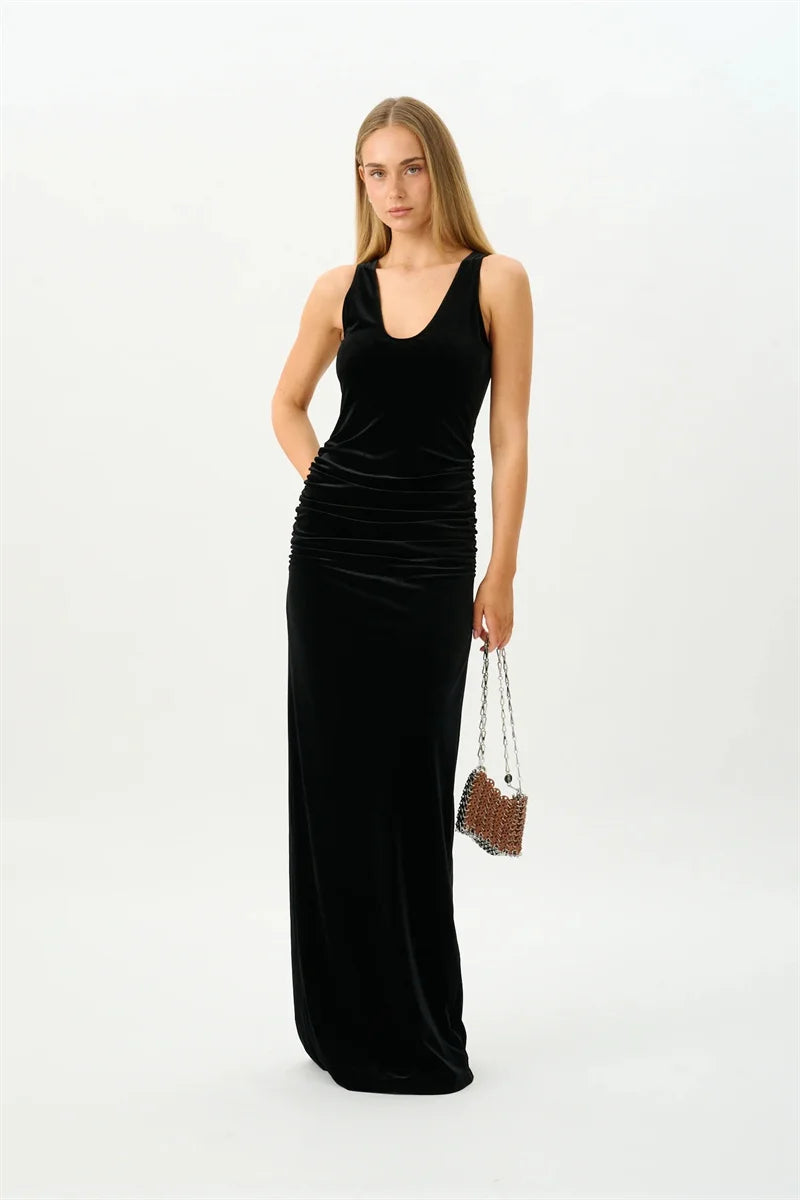 Full length view of a ruched velvet maxi dress