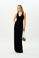Full length view of a ruched velvet maxi dress