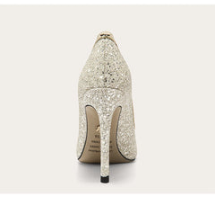 Sparkly high-heeled shoe on a light gray background