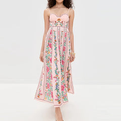 Woman wearing a floral pink dress on a white background