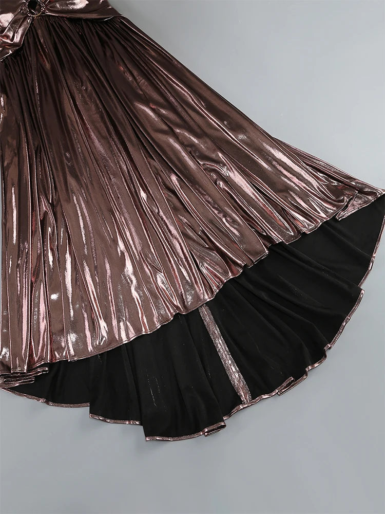 Skirt with metallic and black layers on a light gray background