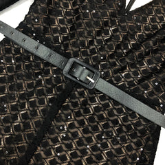 Black and gold patterned fabric with a gray belt
