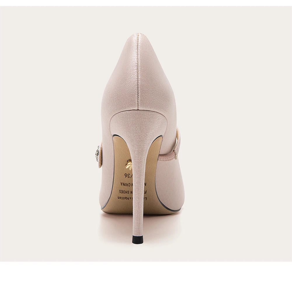Beige high-heeled shoe on a white background