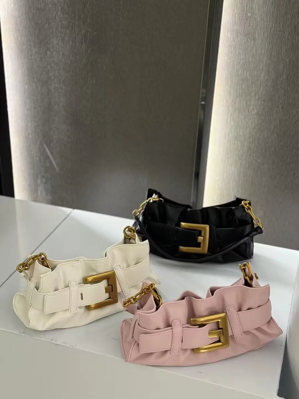 vegan leather ruched handbag with gold buckle,