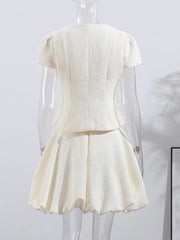 White dress on a mannequin against a white background