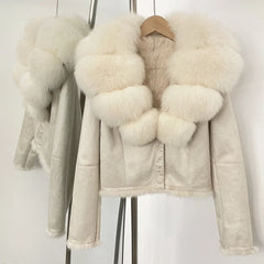Beige leather jacket with fur trim on a white background