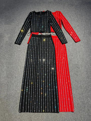 Black and red striped outfit on a gray surface