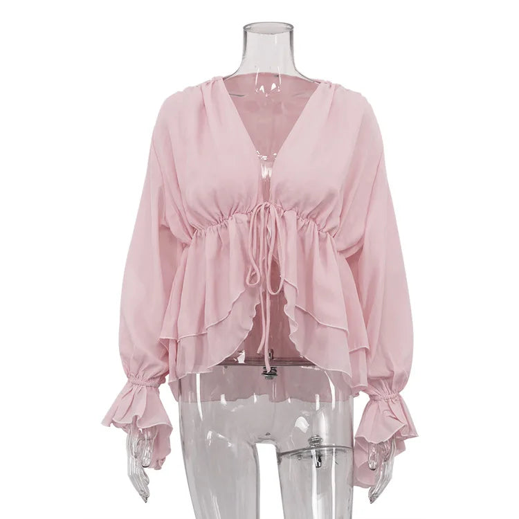 Pink blouse on a mannequin against a white background