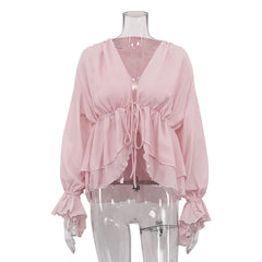 Pink blouse on a mannequin against a white background