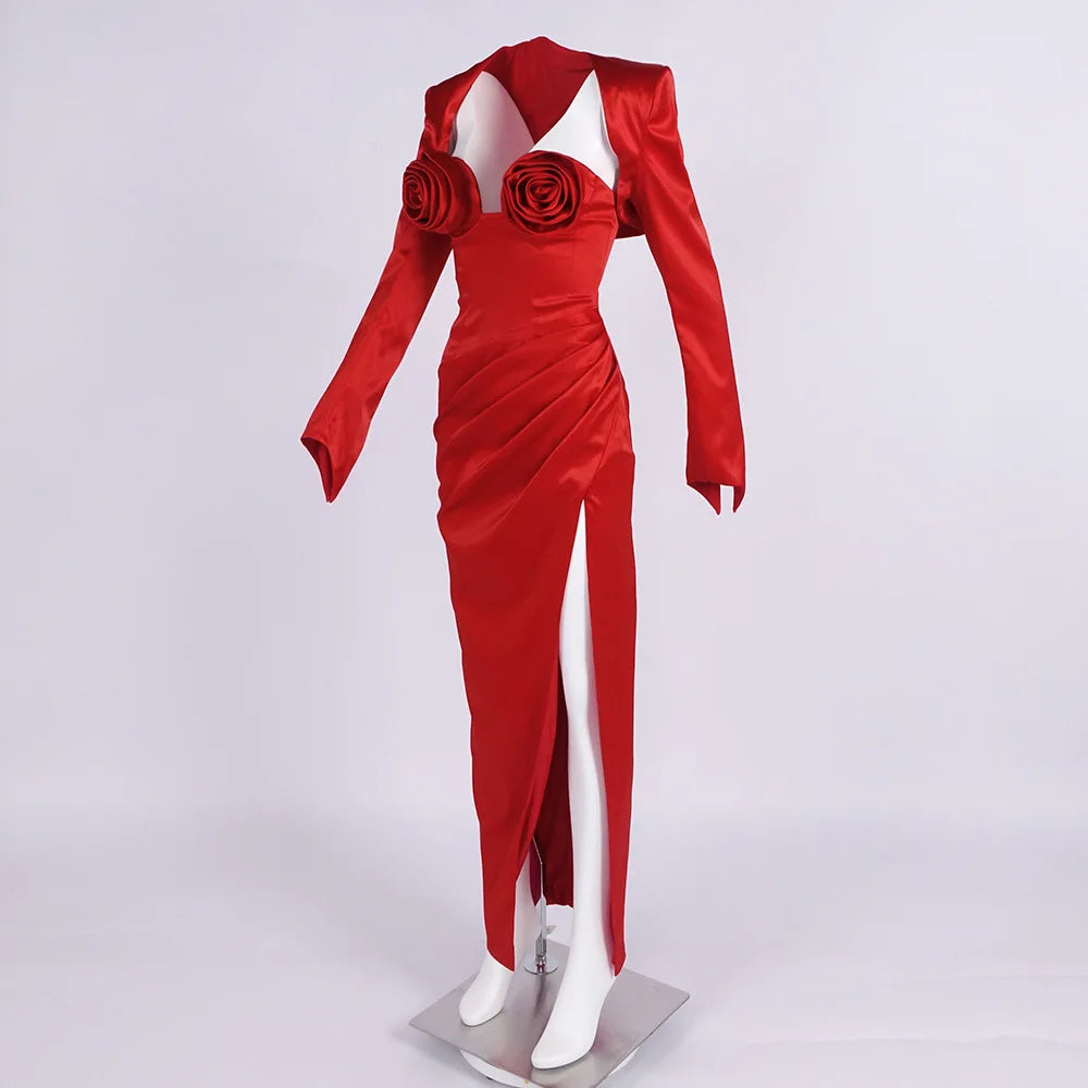 Red evening gown with floral details on a white background