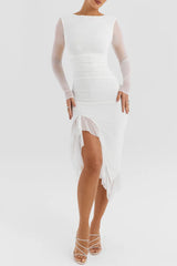 White dress with sheer sleeves and a slit