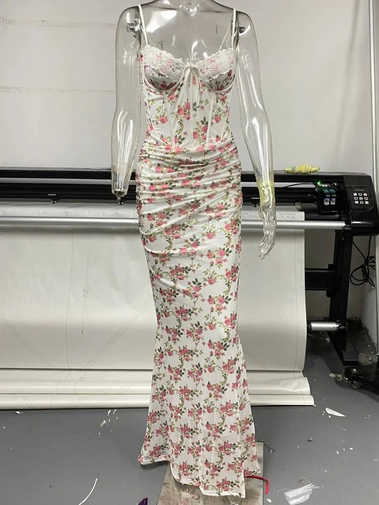 Floral dress on a mannequin in a room with a printer and desk.