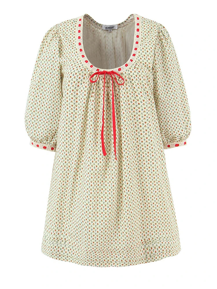 A-line mini dress with O-neck, bow tie neckline, and puff sleeves.
