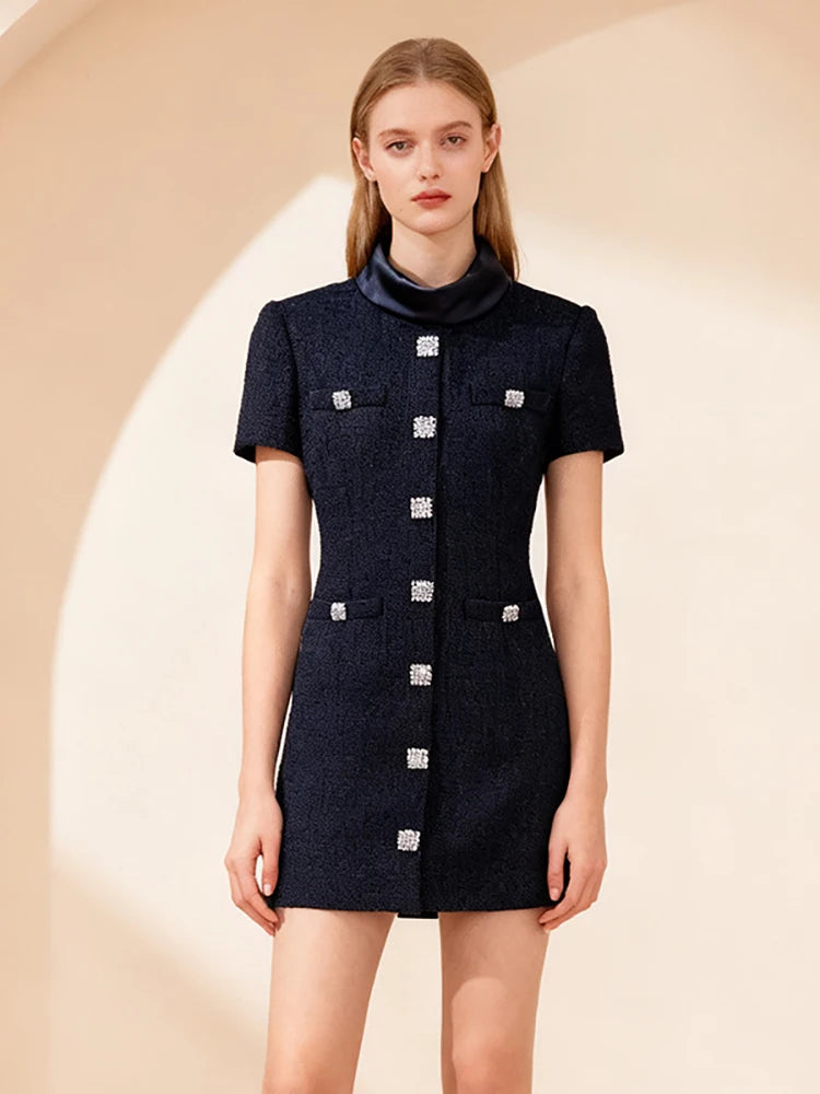 Elegant mini dress styled with structured detailing