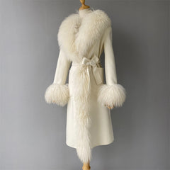 White coat with fur trim on a mannequin against a gray background